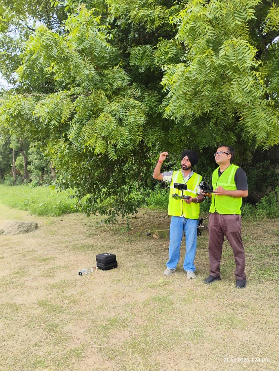 Participants following a drone during guided outdoor pilot practice